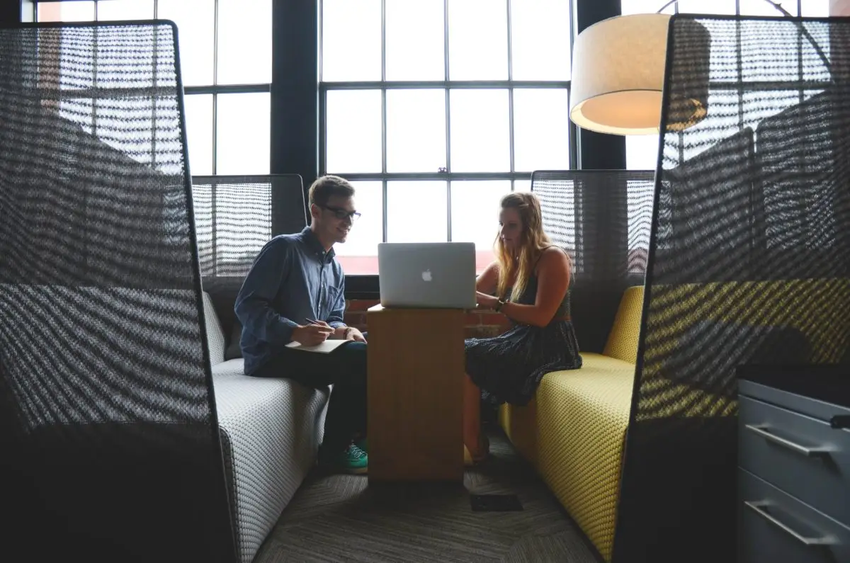 guy and girl discussing over a computer