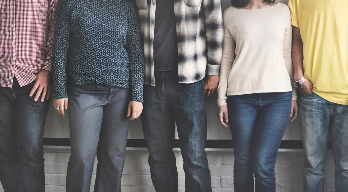 4 adults standing in a row