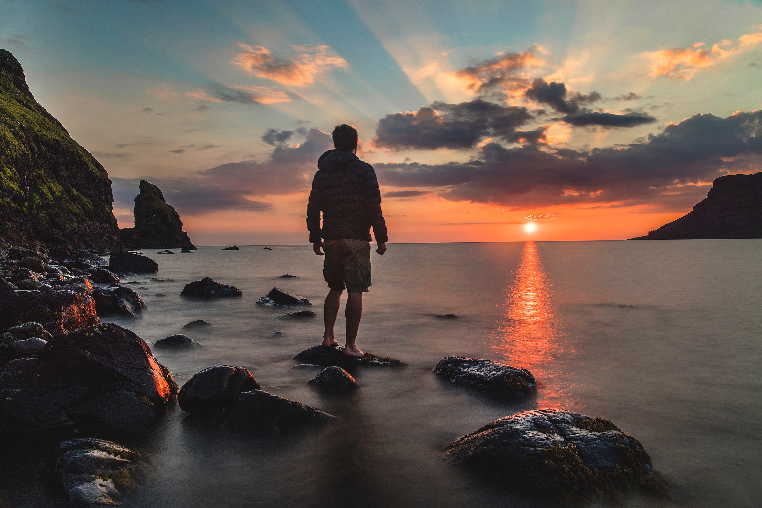 man standing on rocks