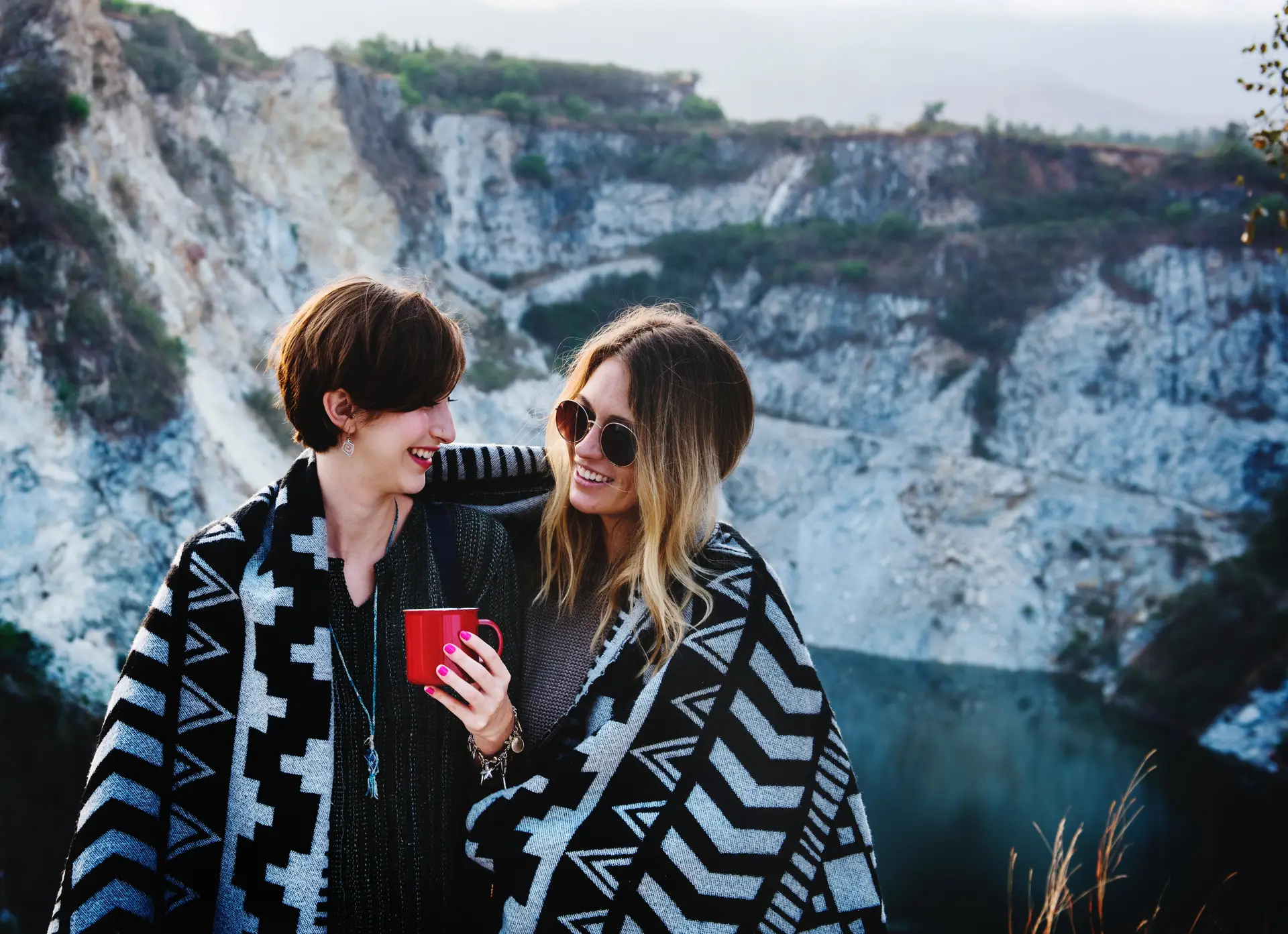 two girls wrapped in a blanket