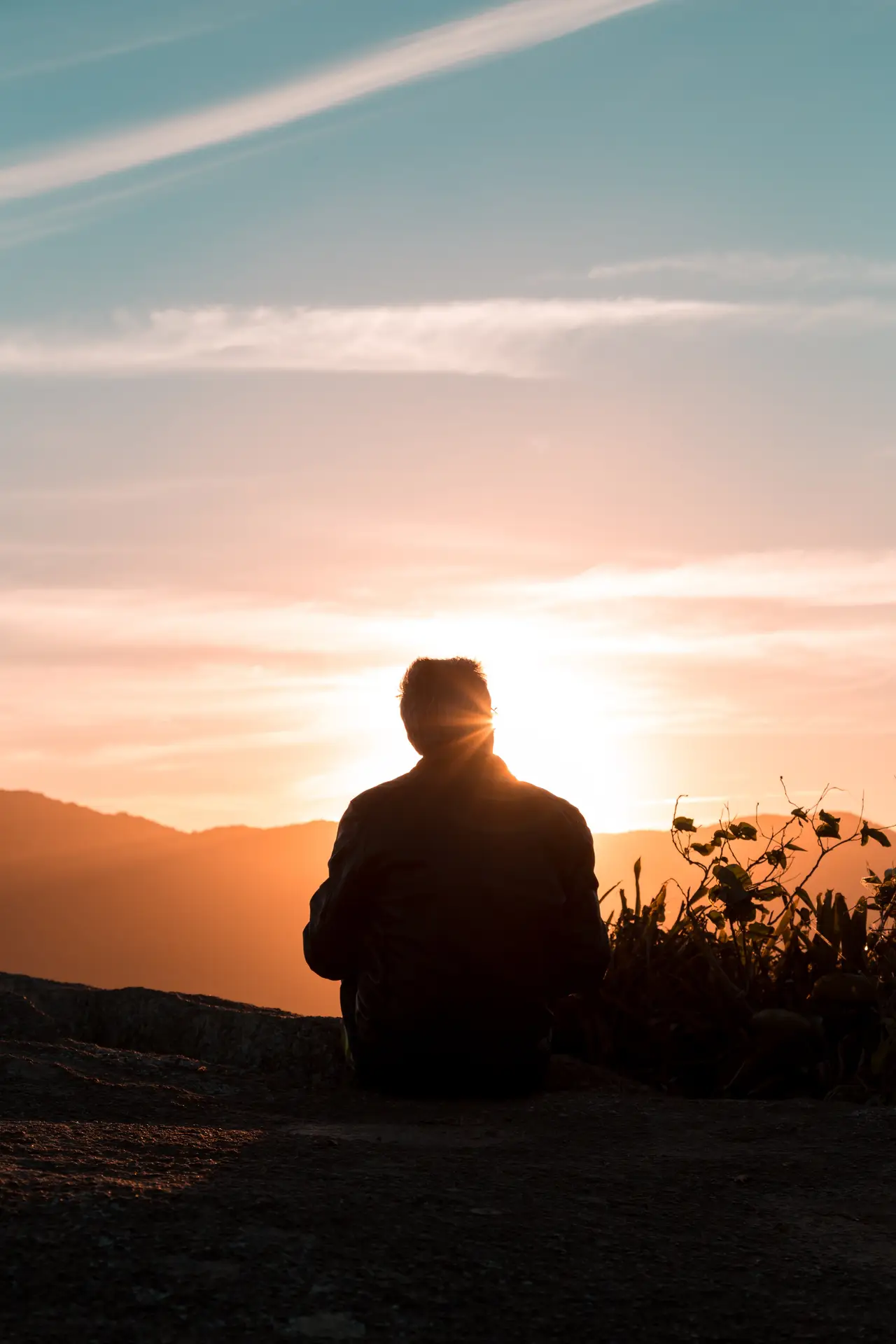 man watching the sunset