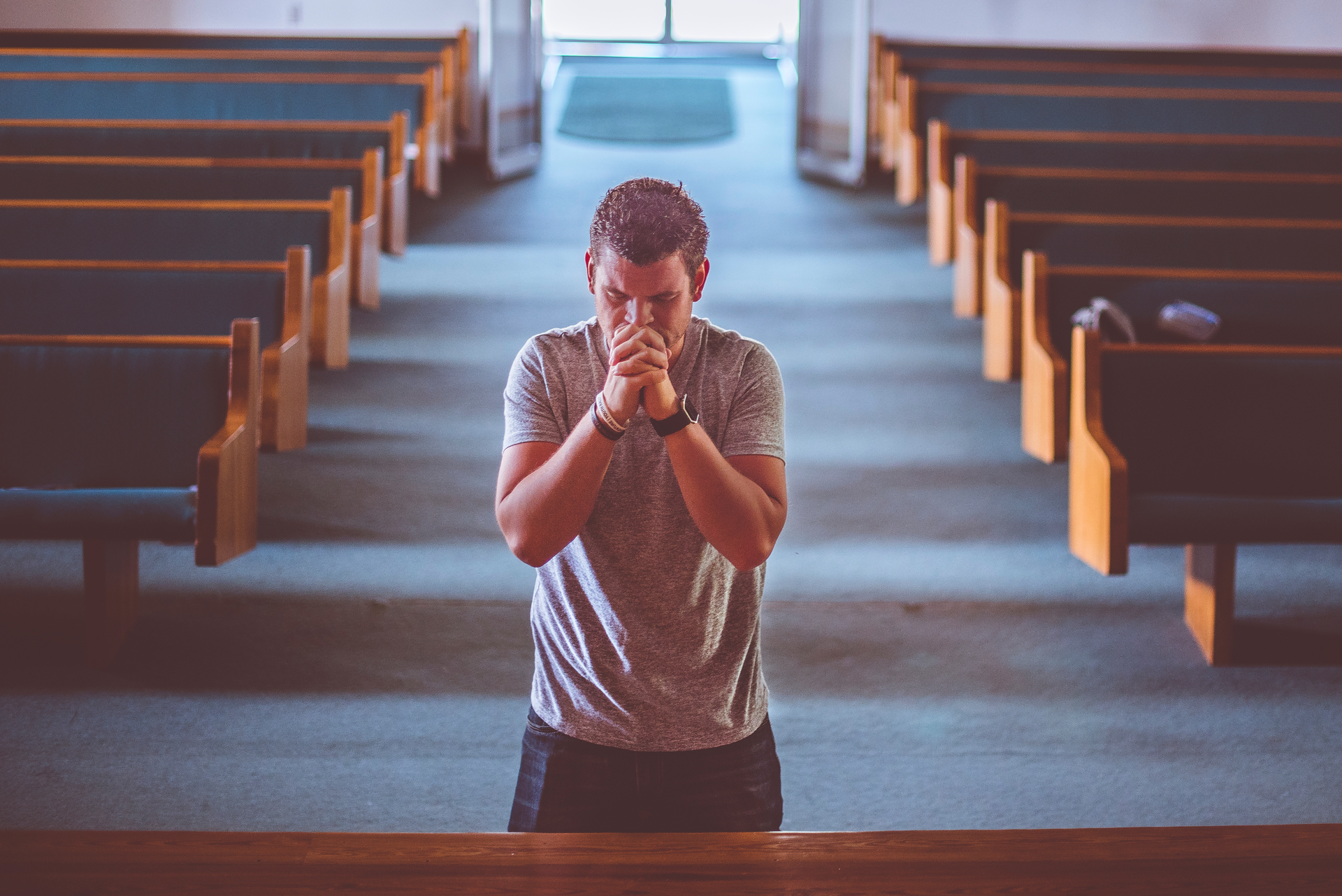 man kneeling to pray