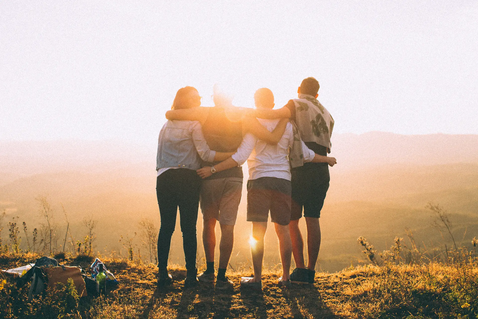 4 teenagers linked arms