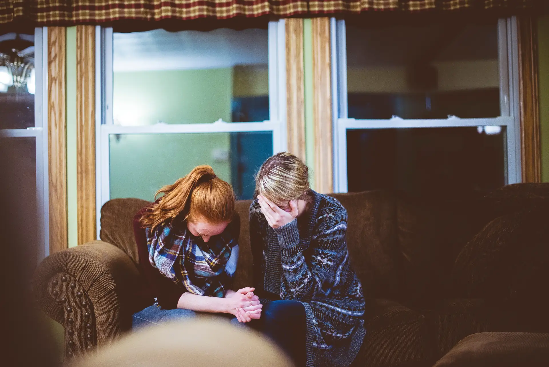 Two girls praying together