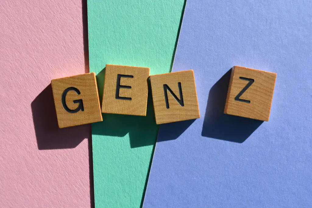 Wooden scrabble style letters spelling out Gen Z on colorful background